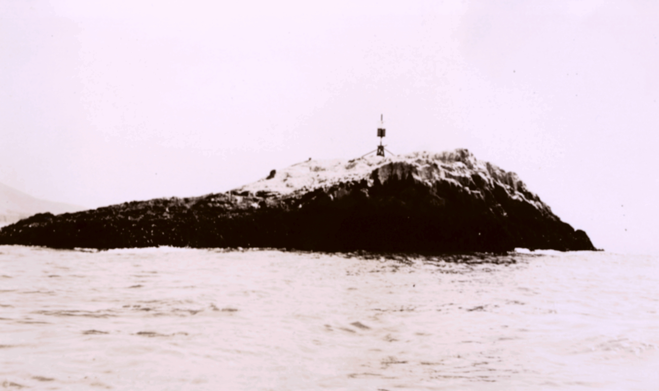 Triangulation station on a rock south of Monterey