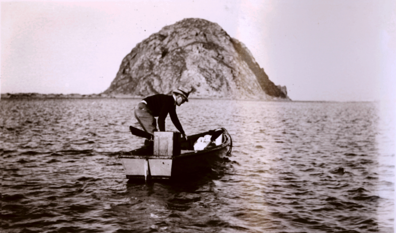 Lieutenant Charles Pierce, chief of party, proceeding to triangulation stationon top of Morro Rock