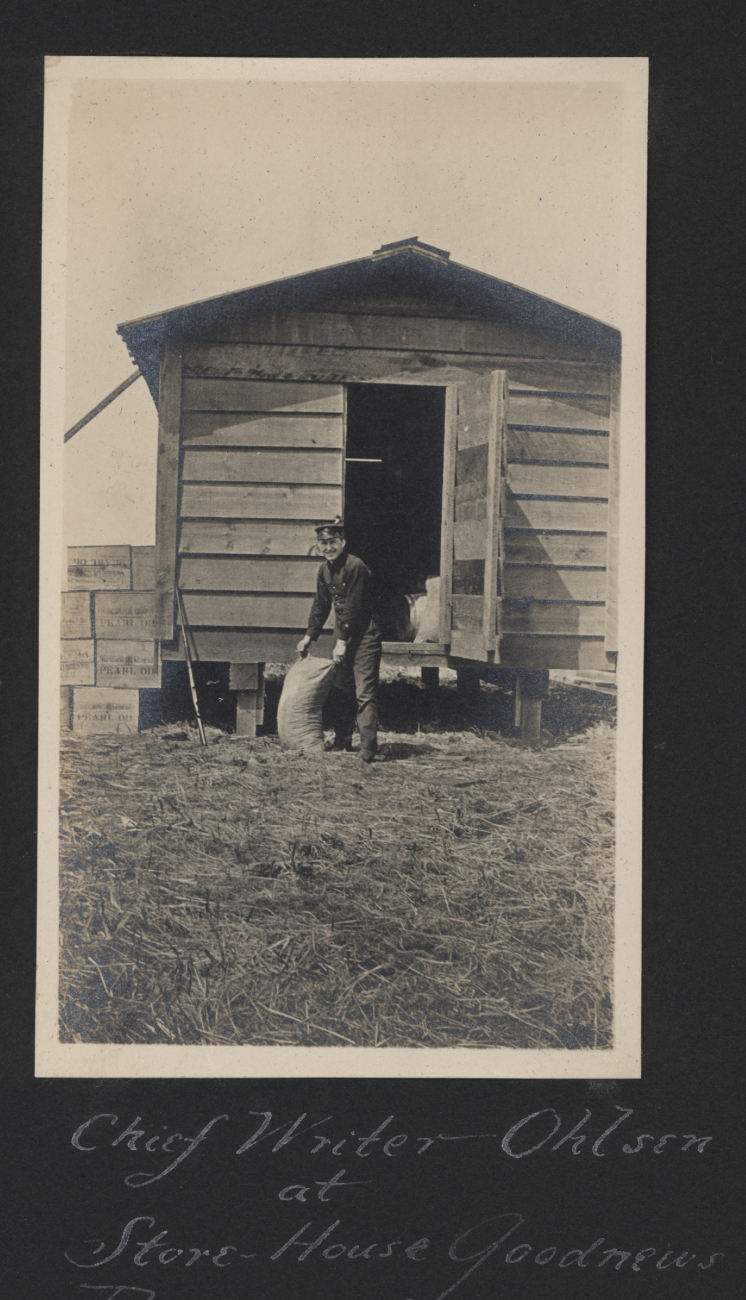 Chief writer (yeoman) Ohlsen at the store-house at Goodnews Bay