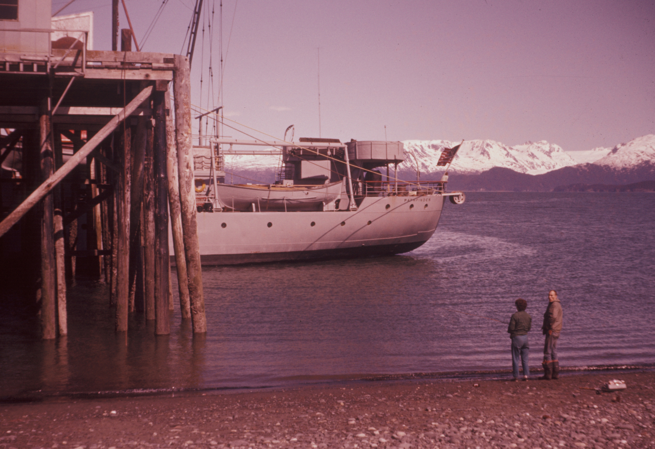 Coast and Geodetic Survey ShipPATHFINDER tied up at low tide at a CookInlet pier