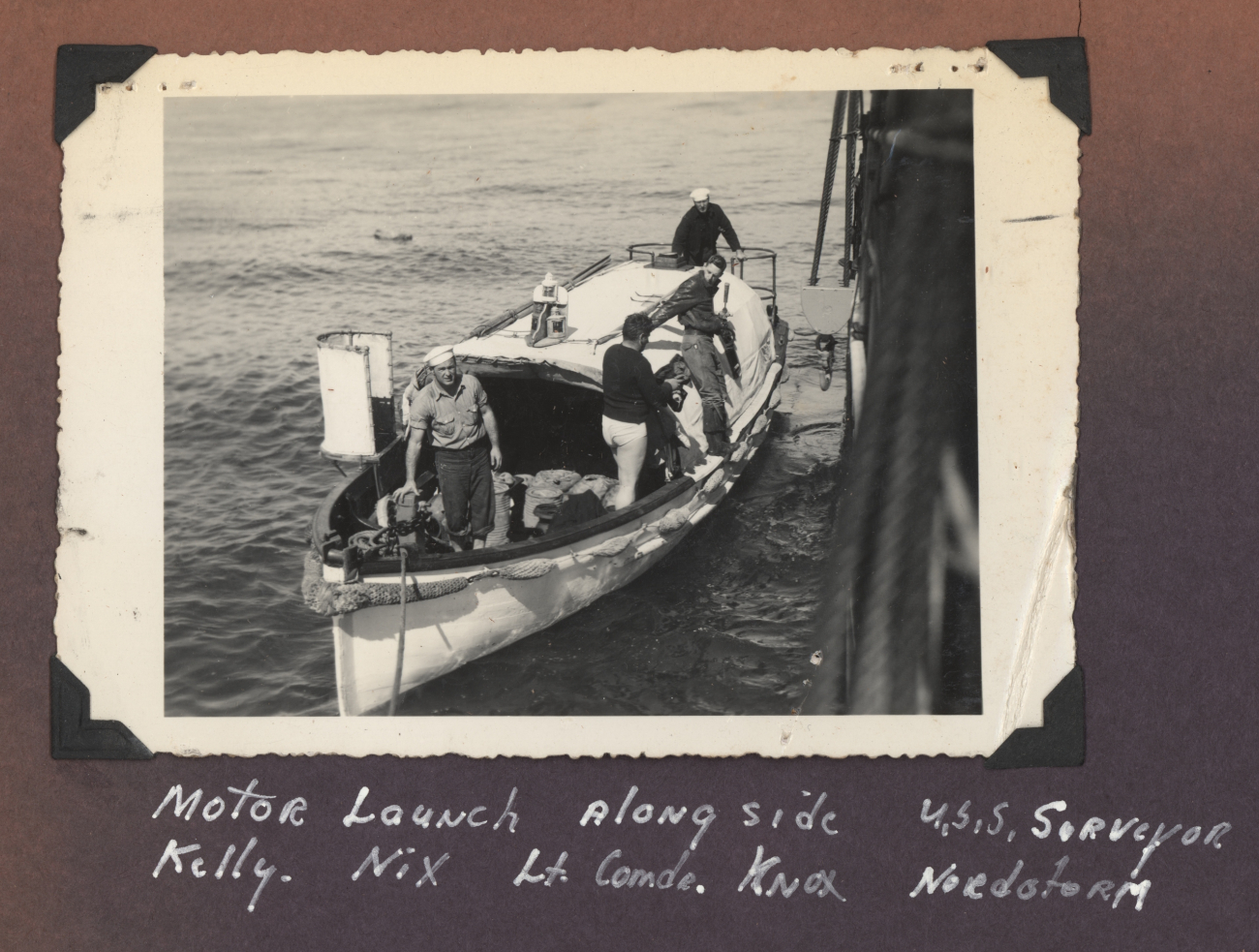 Motor launch alongside USC&GS; Ship SURVEYOR - Kelly, Nix, Knox, andNordstrom