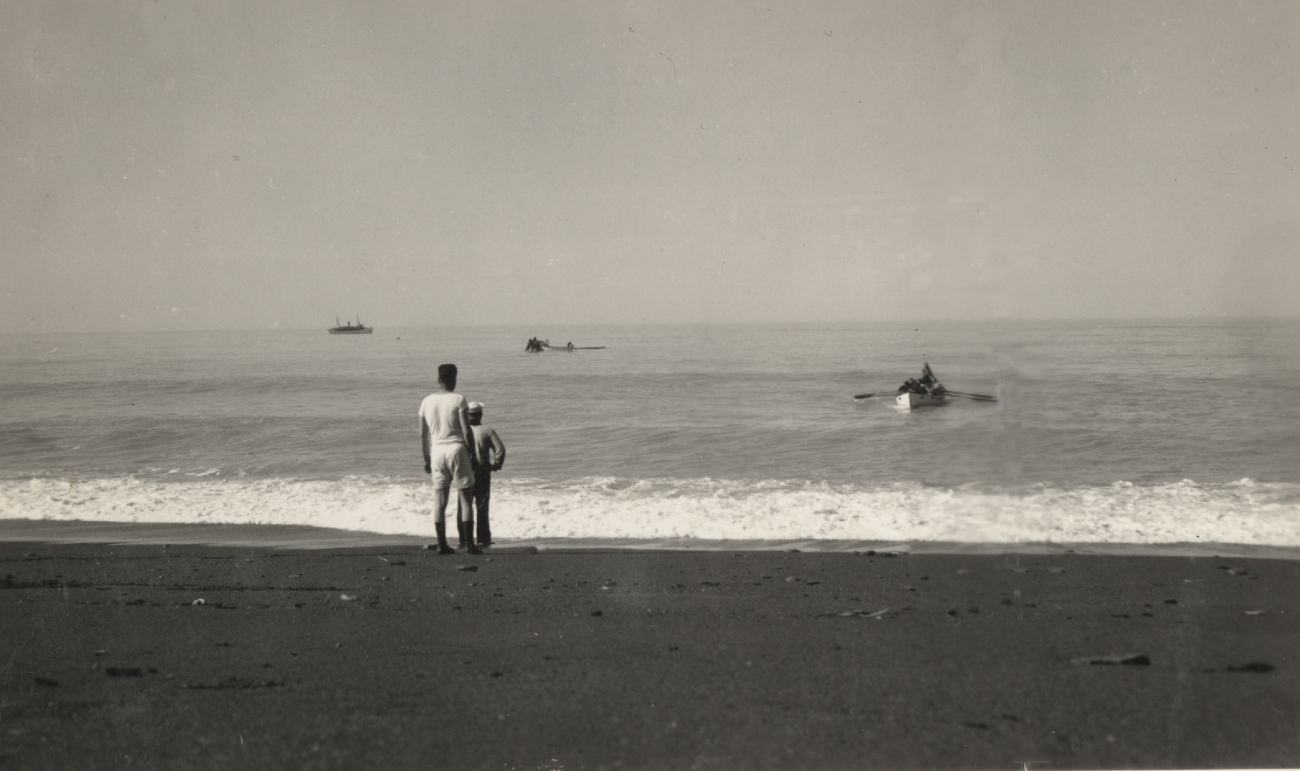 Whale boat approaching shore while USC&GSS; SURVEYOR lies tooffshore