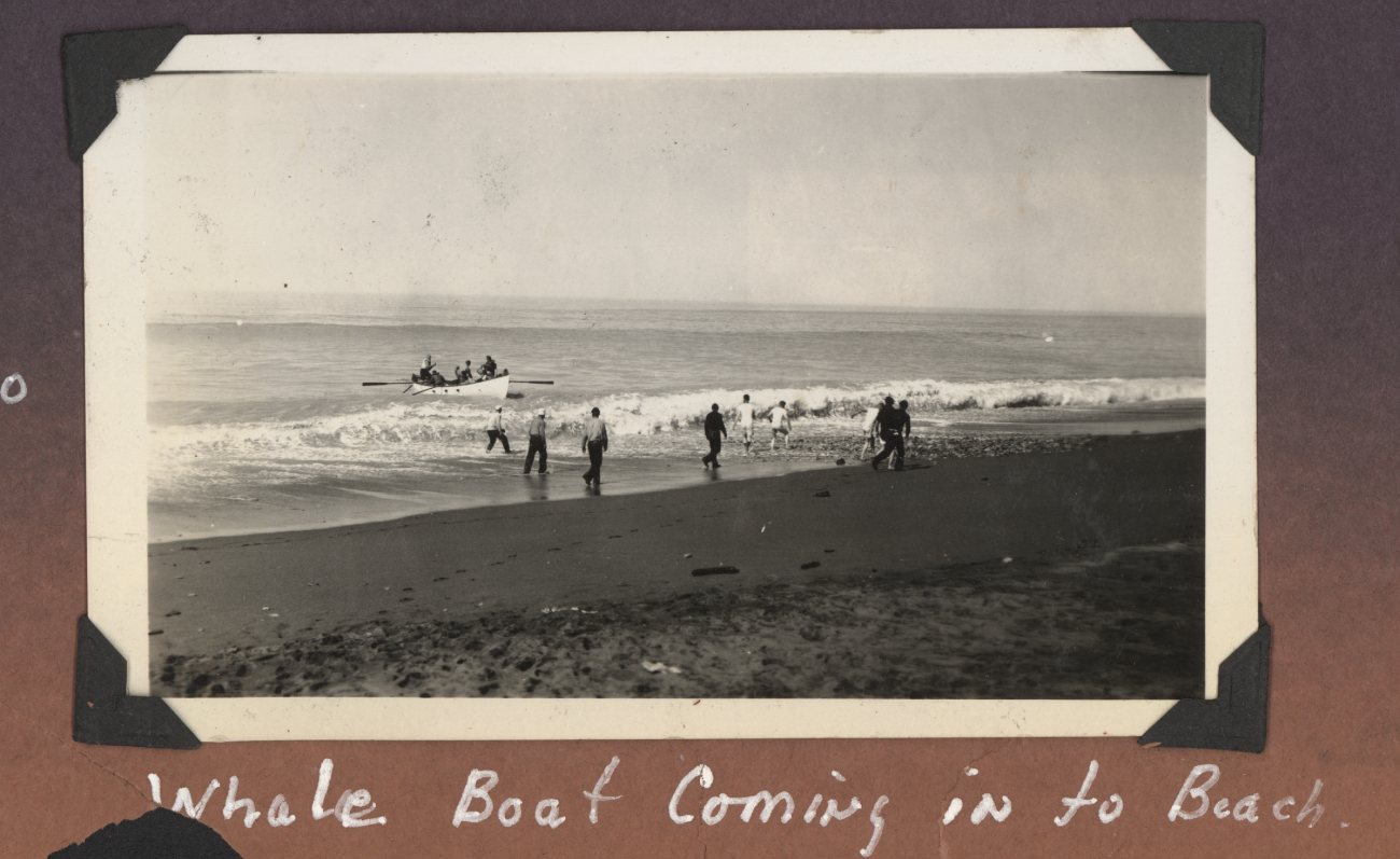 Whale boat coming into beach to offload personnel and supplies