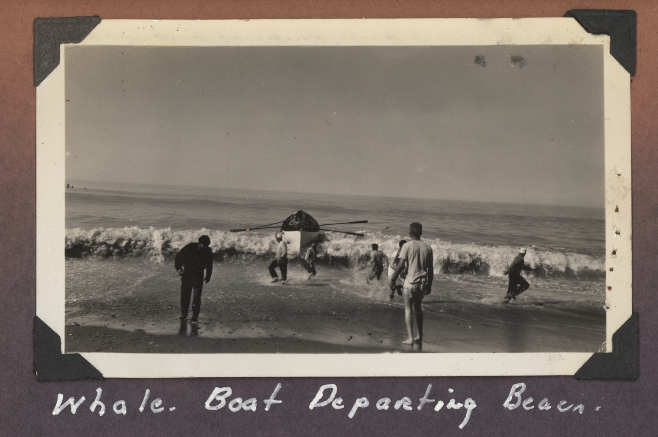 Whale boat departing beach