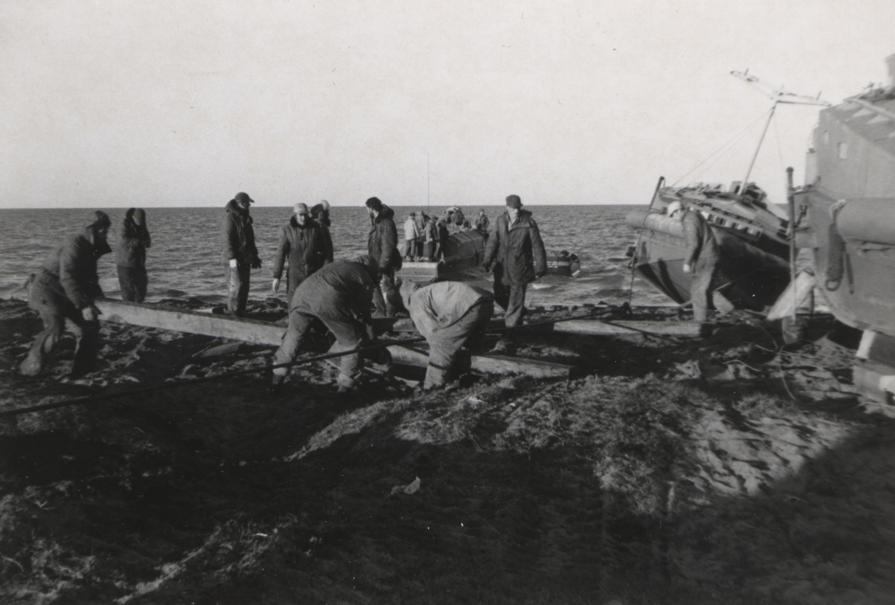 Preparing skids to launch survey boats