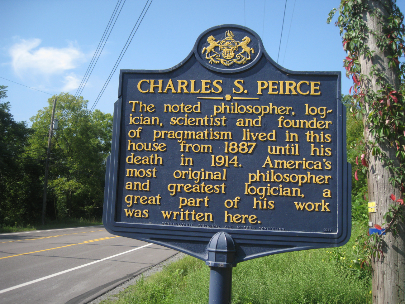 Roadside history marker noting Arisbe, the home of Charles Sanders Peirce,son of Benjamin Peirce, and considered one of America's greatest philosophers