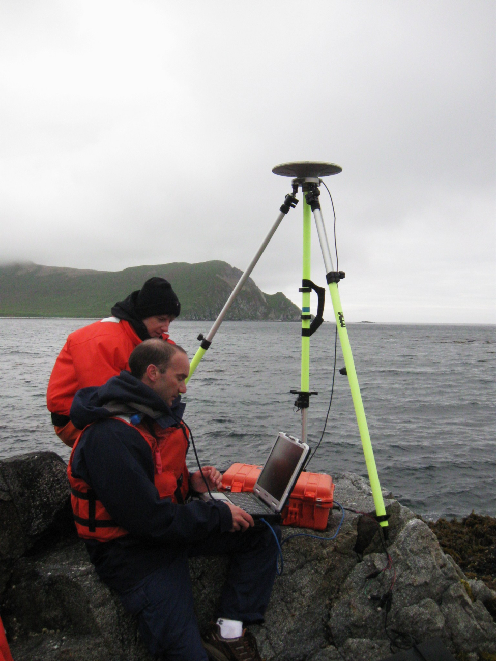 Brandy Geiger (L) and Bill Carrier working on horizontal control station set upat Bird Island
