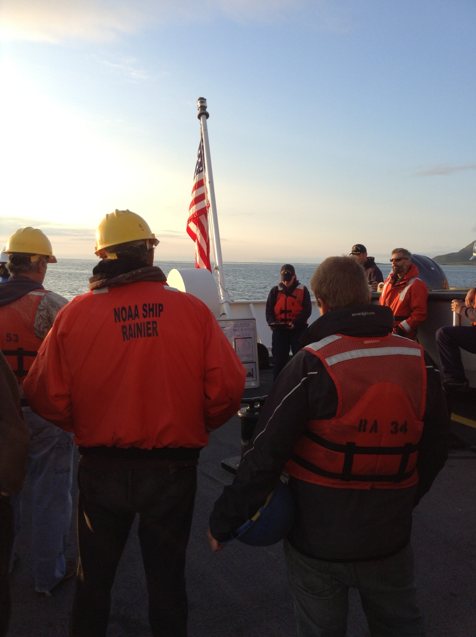 The Field Operations Officer (FOO) Megan McGovern, leads a morning safetymeeting prior to sending out the launches from the NOAA Ship RAINIER