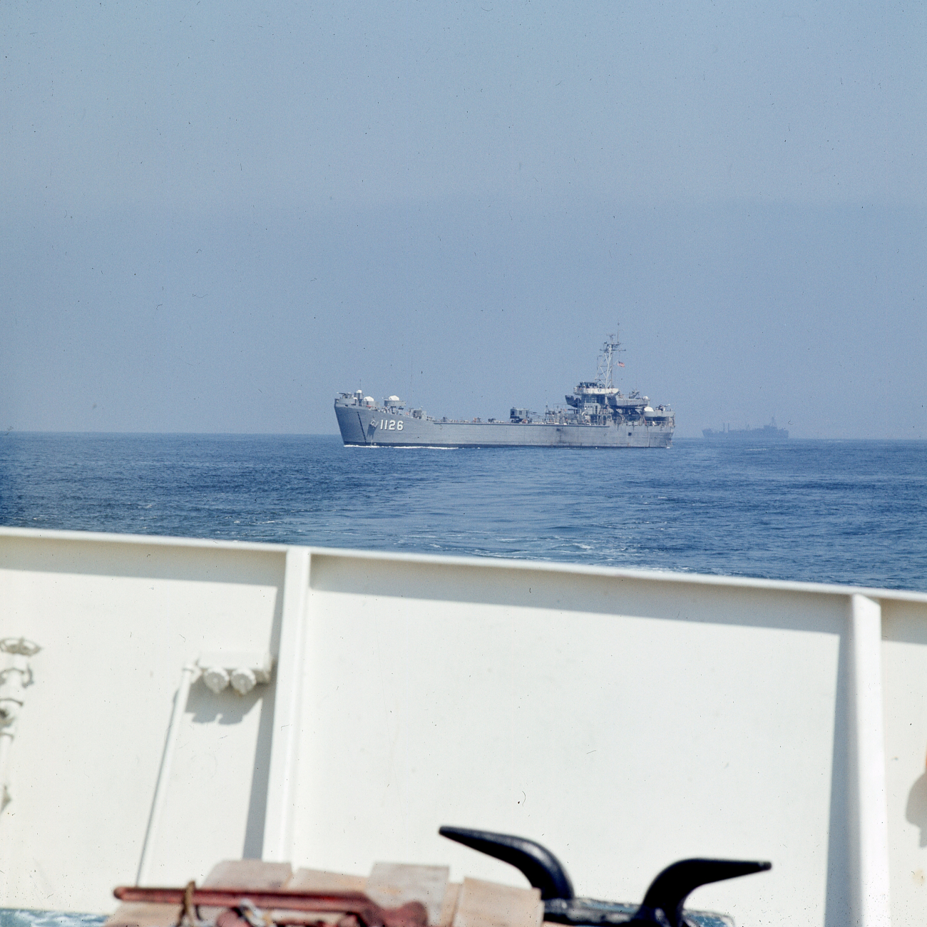 Navy vessel passing close astern of ESSA Ship DAVIDSON off San Diego
