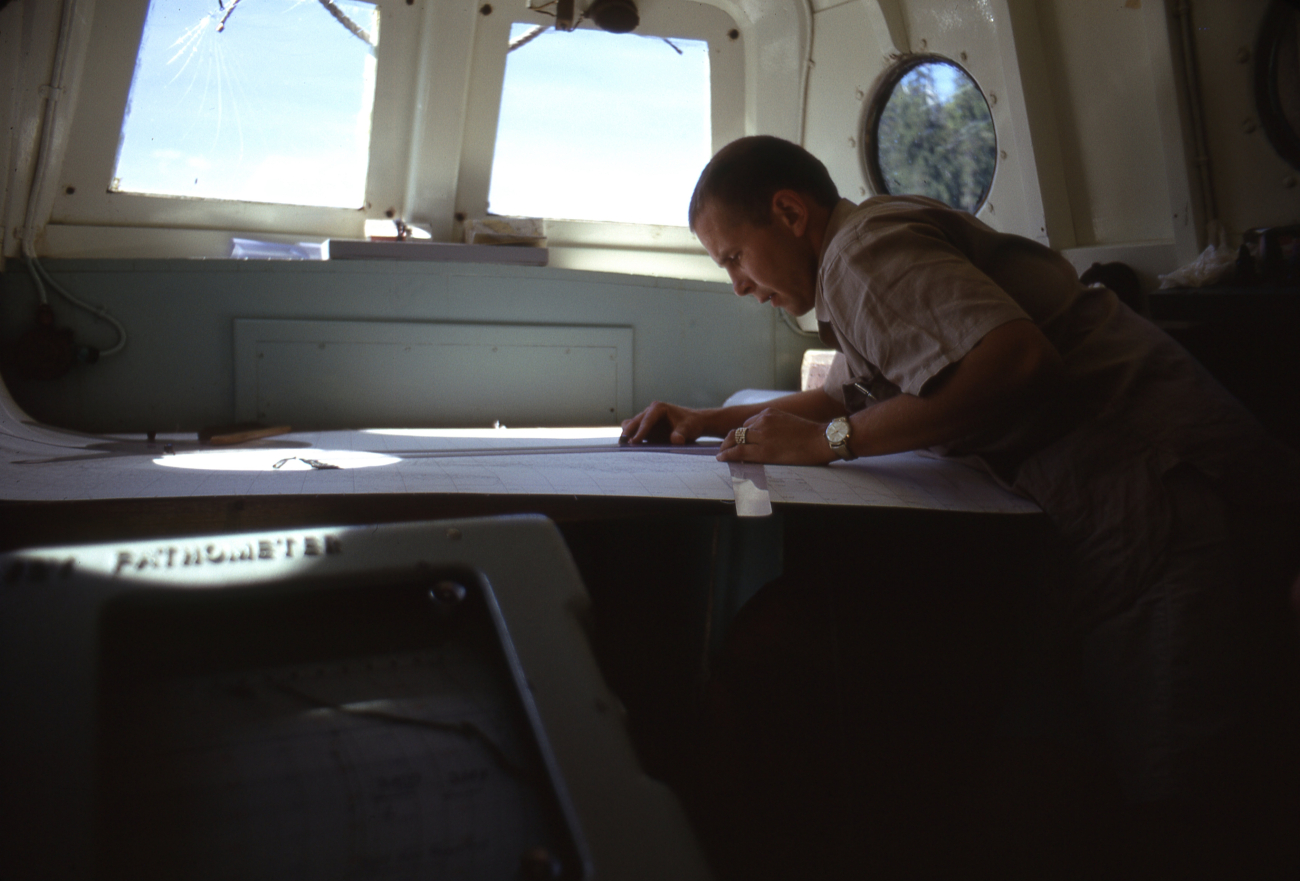 Lieutenant Melvin Maki plotting three-point sextant fix with three armprotractor