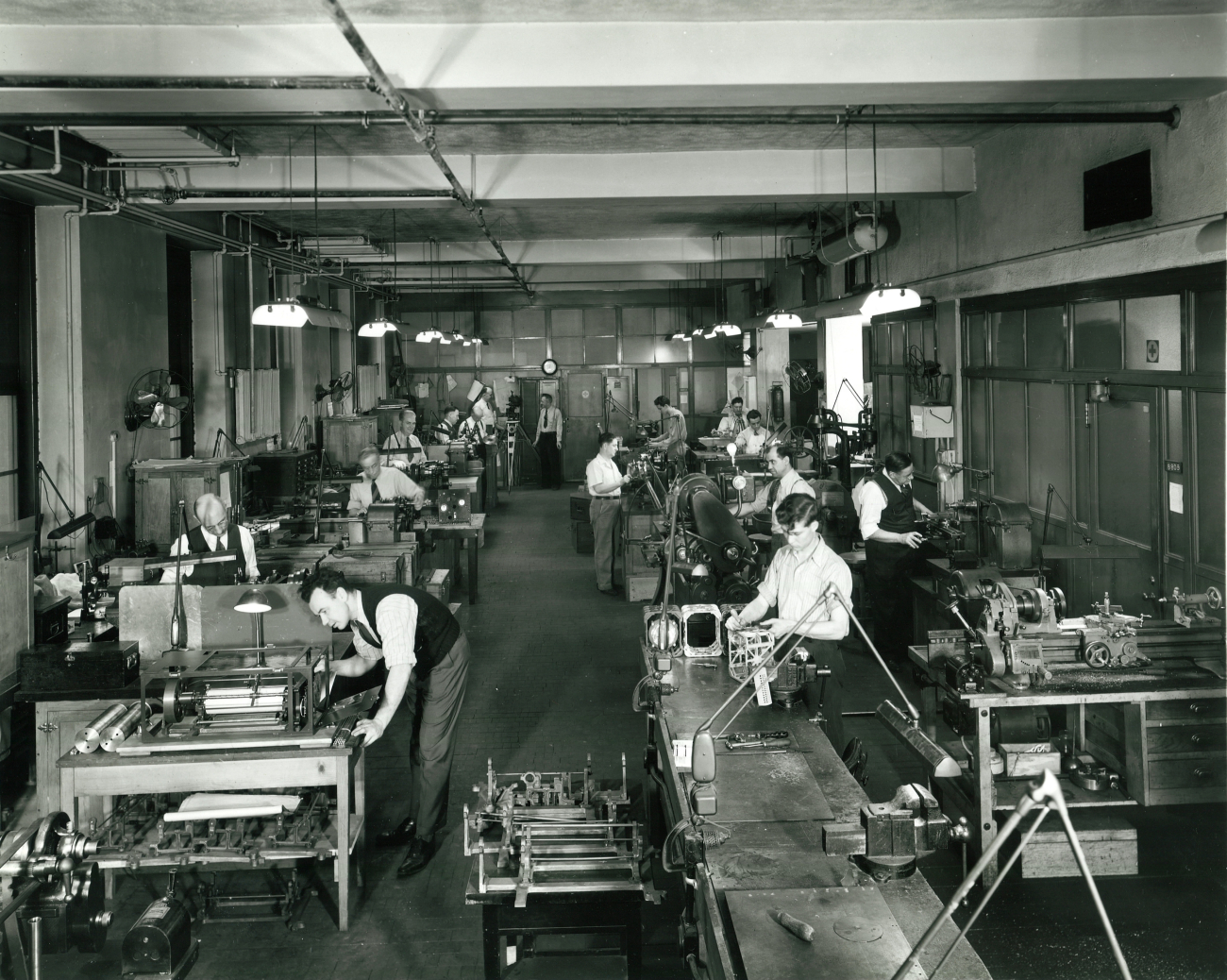 Instrument shop with instrument-makers at work