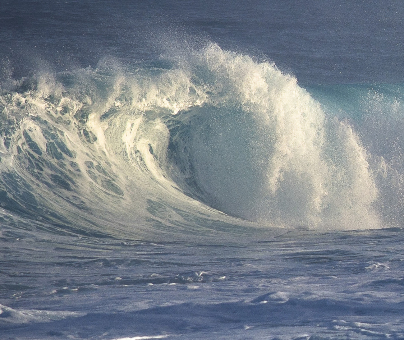 Ocean swell from a winter storm far to the north thunders ashore as hazardoussurf