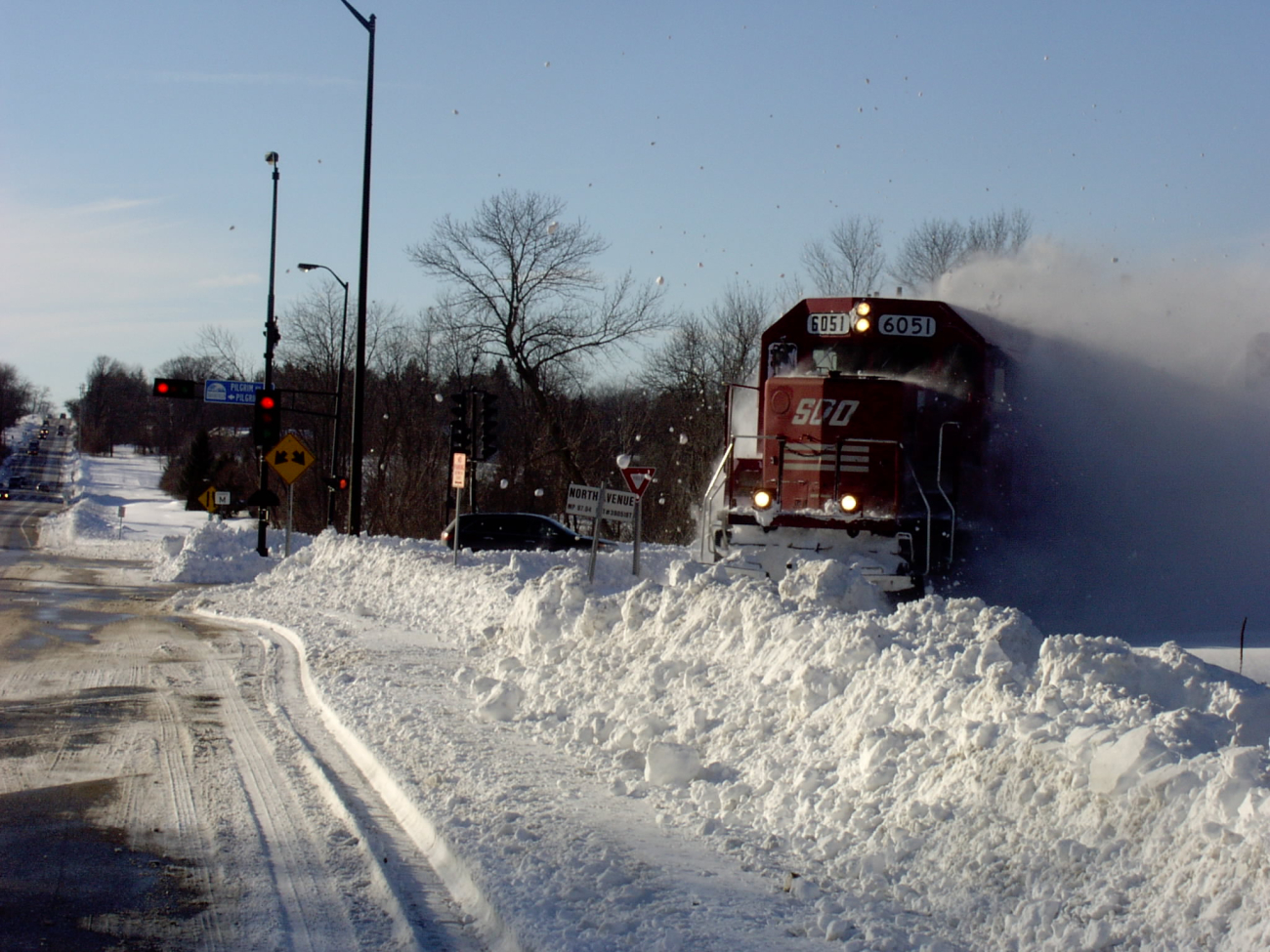 Freight Train taking on newly plowed roads
