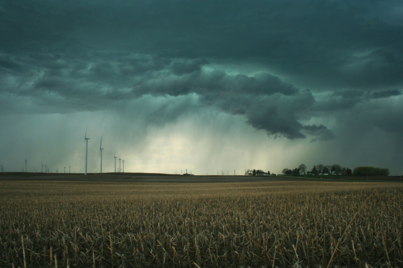 Stormy skies loom over a windfarm