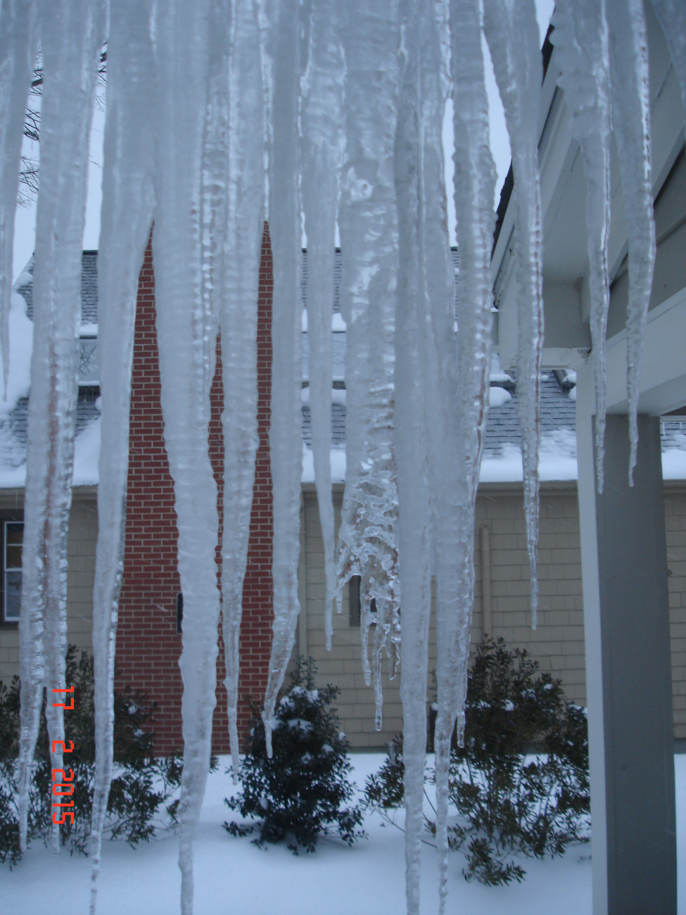 View of neighbor's house through the icicles