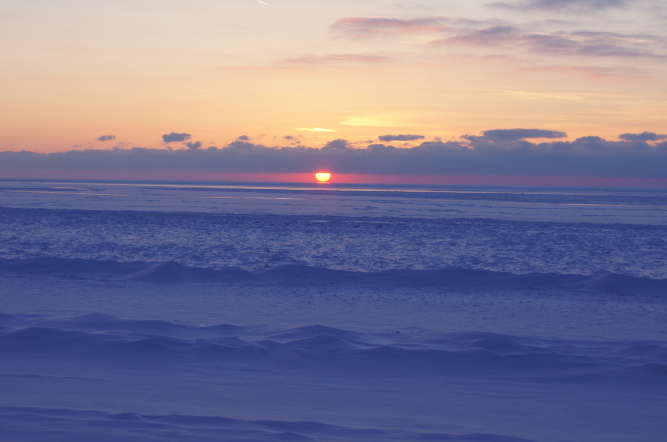 Sunset over frozen Lake Michigan