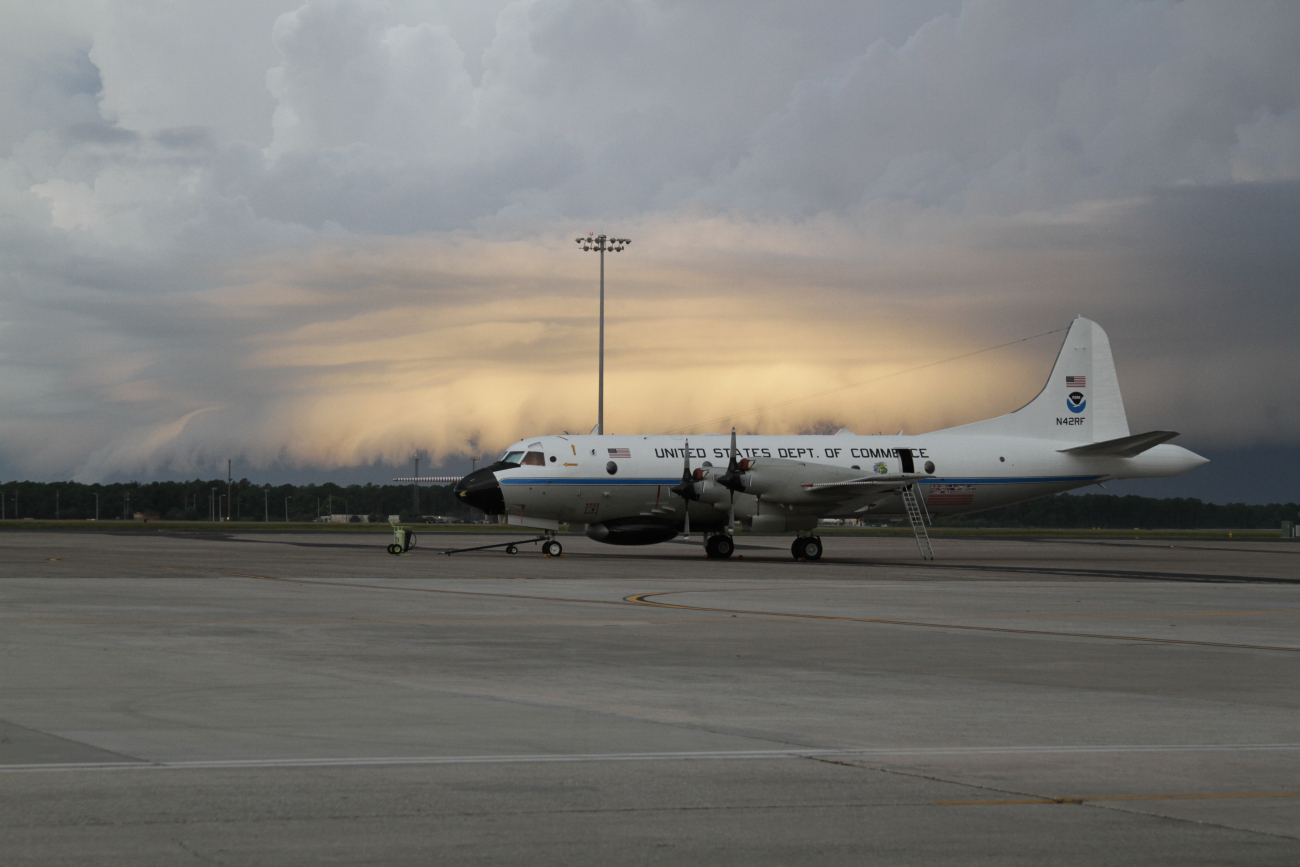 NOAA's WP-3D Hurricane Hunter aircraft (N42RF or commonly known as Kermit)on the MacDill AFB, FL ramp with a storm approaching; May 2014
