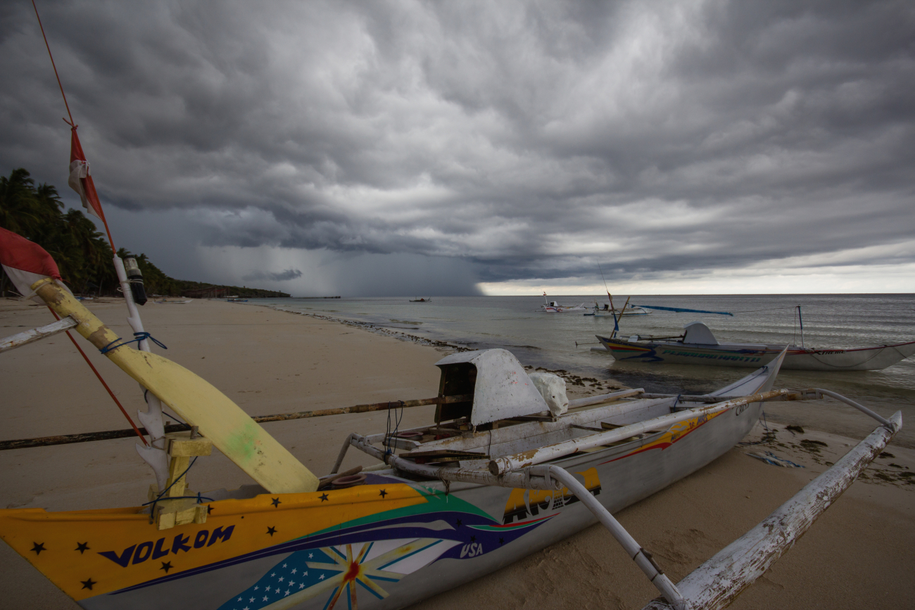 An afternoon thunderstorm approaches Bira Beach