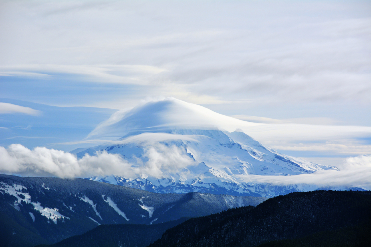 Lenticular clouds forming over Mount Hood as a system rolls in