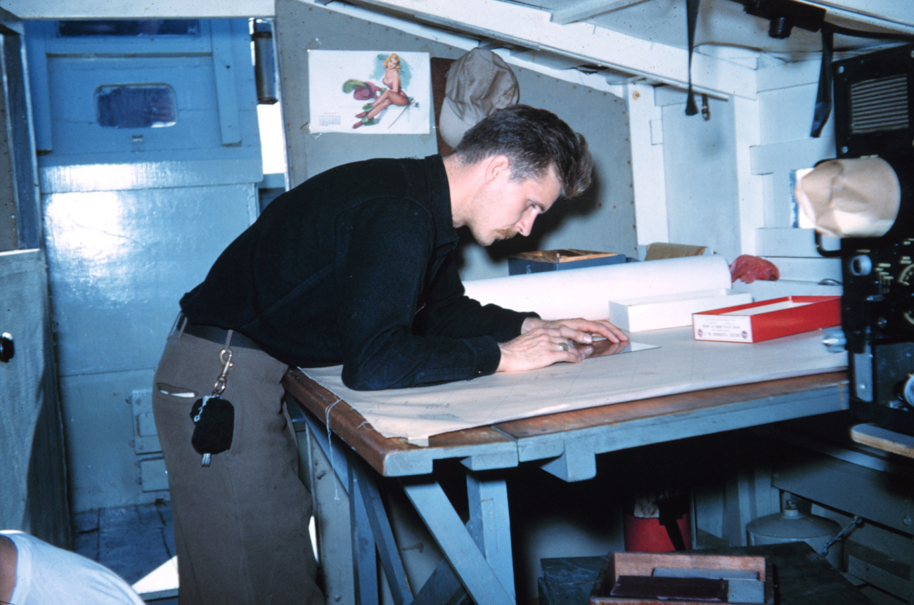 Harley Nygren working on a hydrographic survey sheet on Survey Launch #15