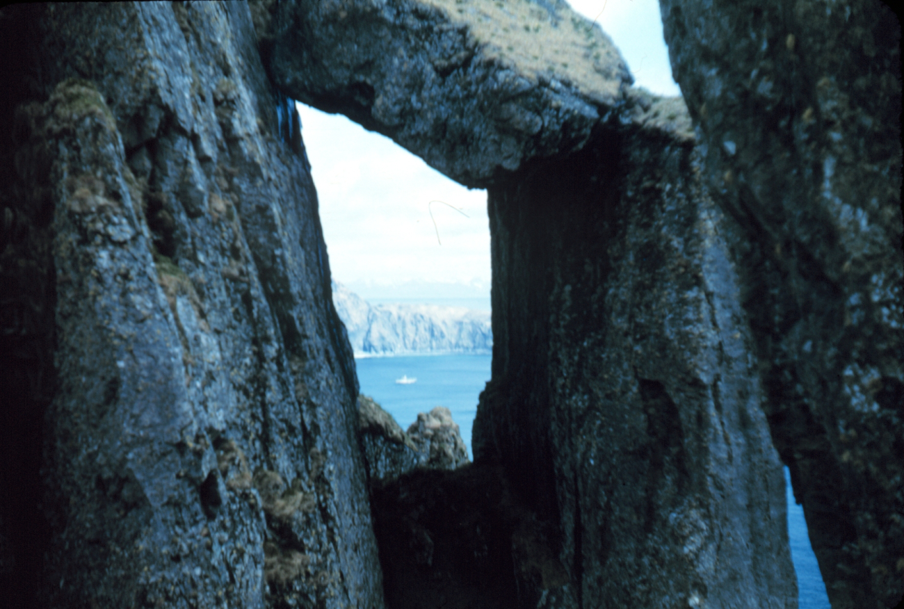 PATHFINDER framed between columnar rocks at Ragged Point