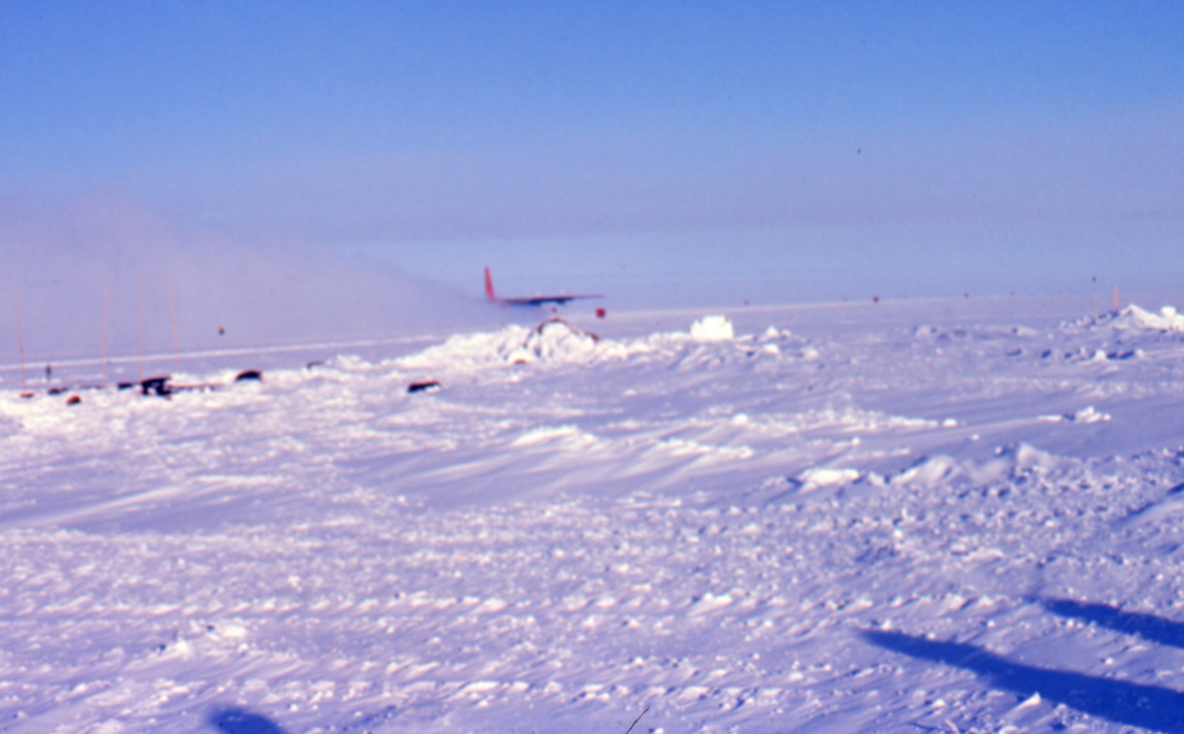 The last plane at South Pole Station taking off before the fall sunset