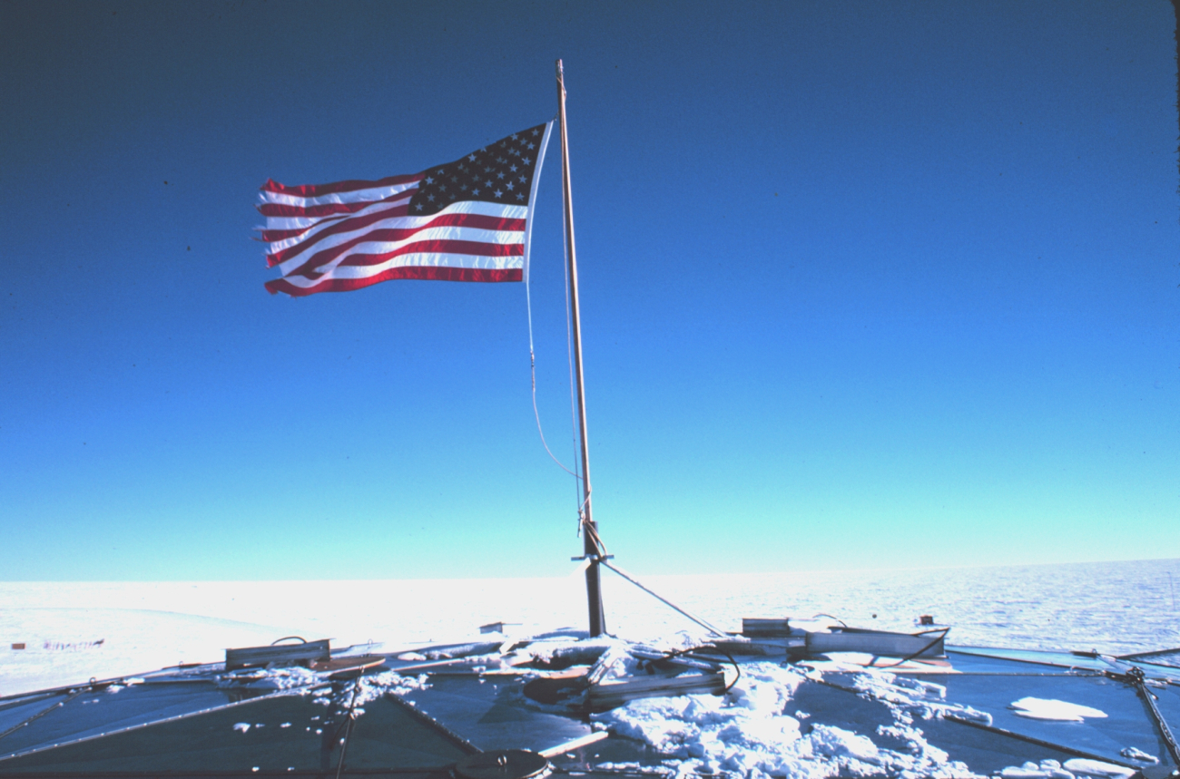 The United States Flag at the top of the South Pole Station geodesic dome