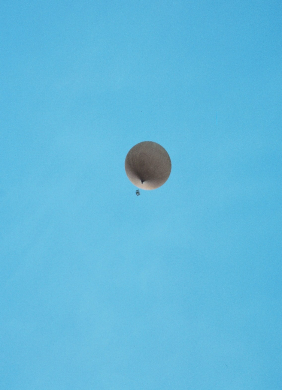 Meteorological balloon with instrument package swinging below at McMurdoStation