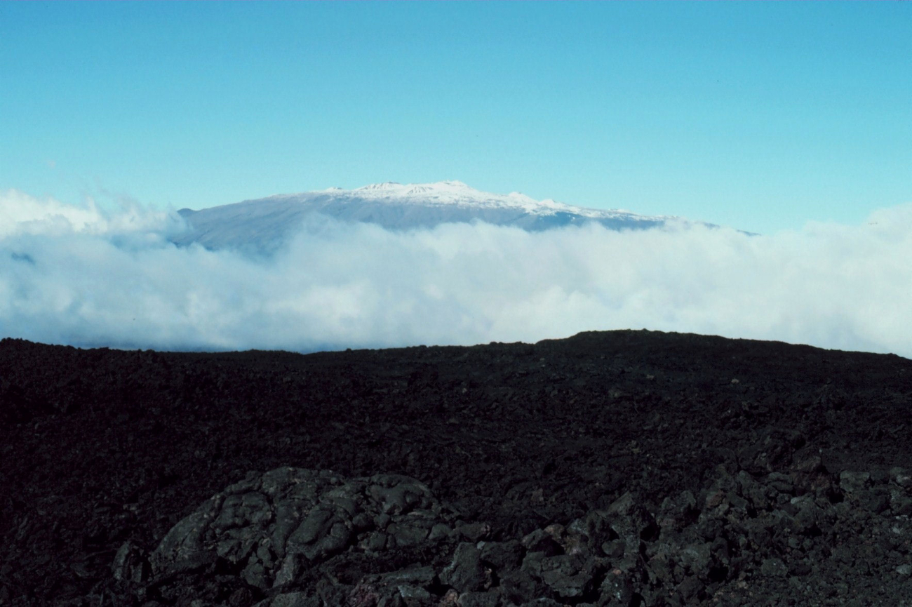 Each day the cloud cover rolls up Mauna Loa from the Hilo area