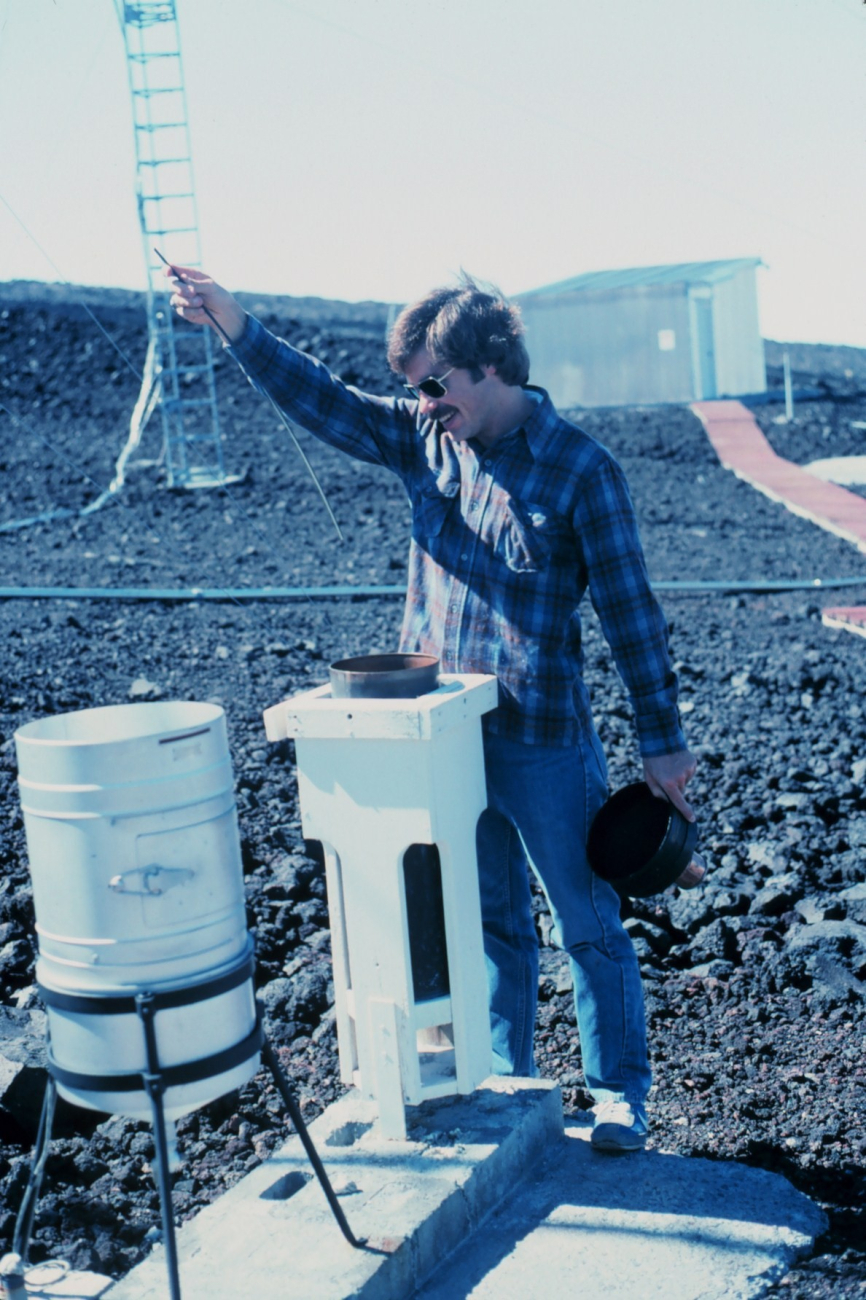 John Bortniak taking rainfall readings at the Mauna Loa Observatory