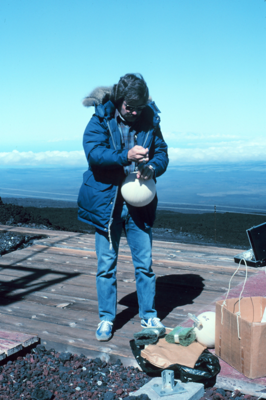 Using an evacuated glass flask to collect air sample to be analyzed for carbondioxide