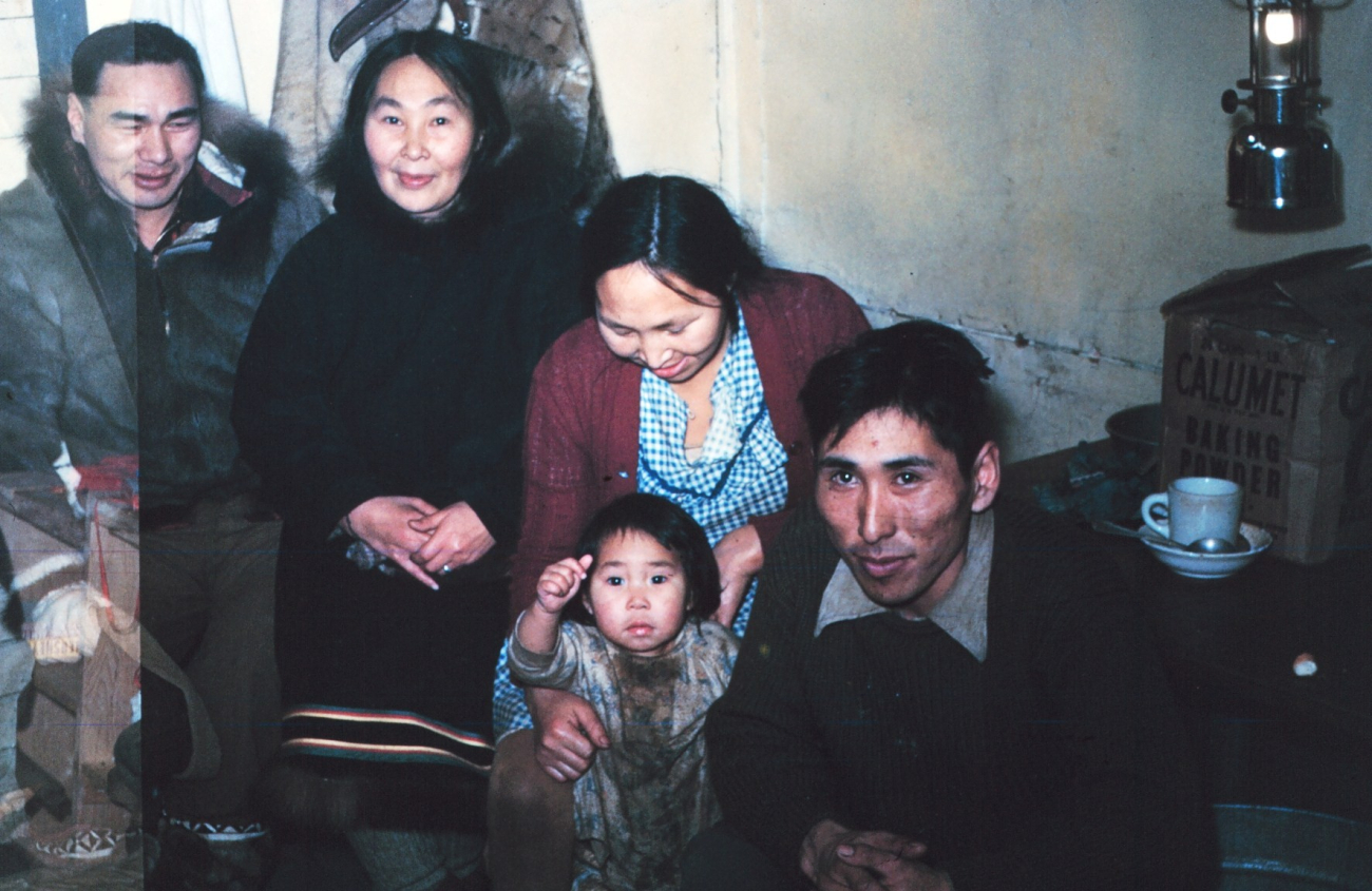 Leo Attungowruk and wife standing, Warren Neokok and wife sitting