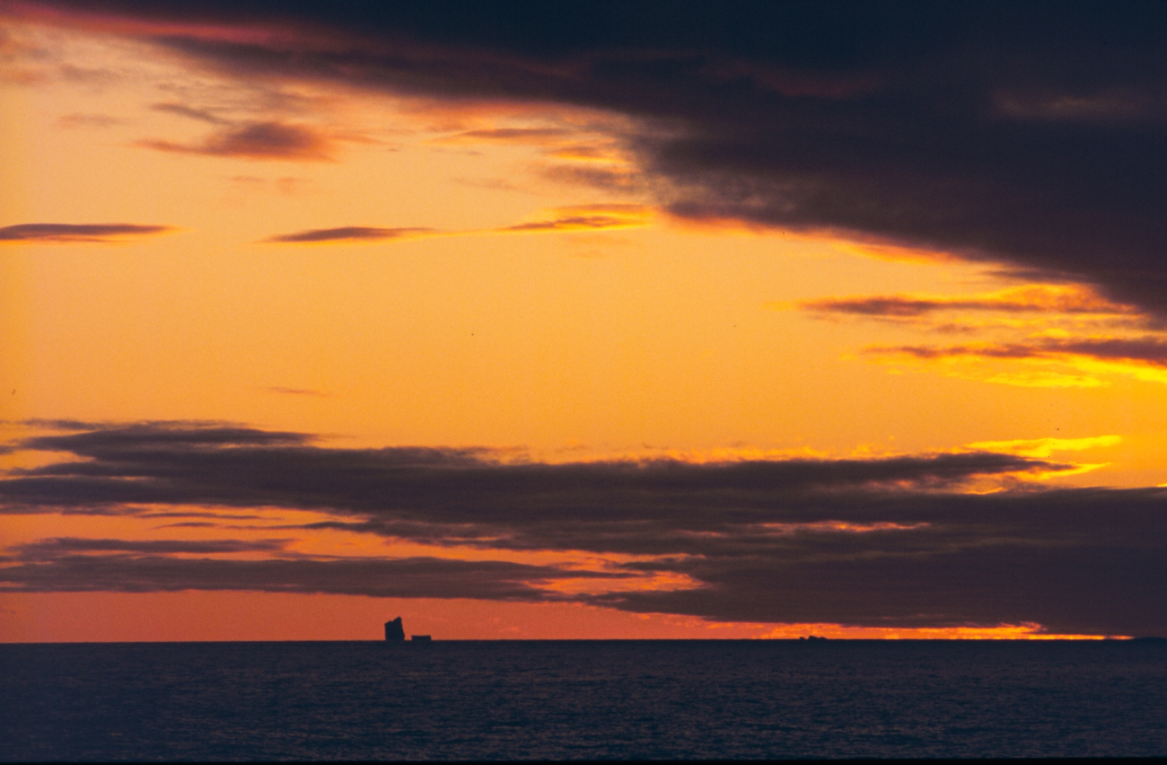 Iceberg silhouette at sunset