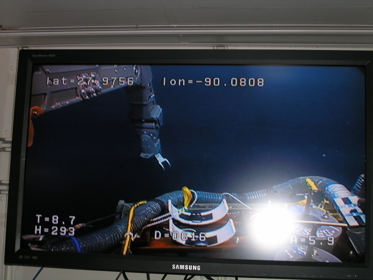 Watching the work underwater from the big screen in the laboratory