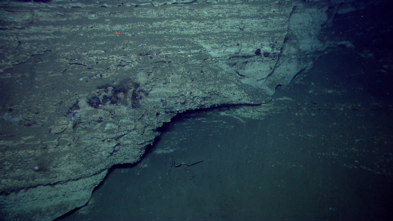 Failure of canyon wall along an irregular surface