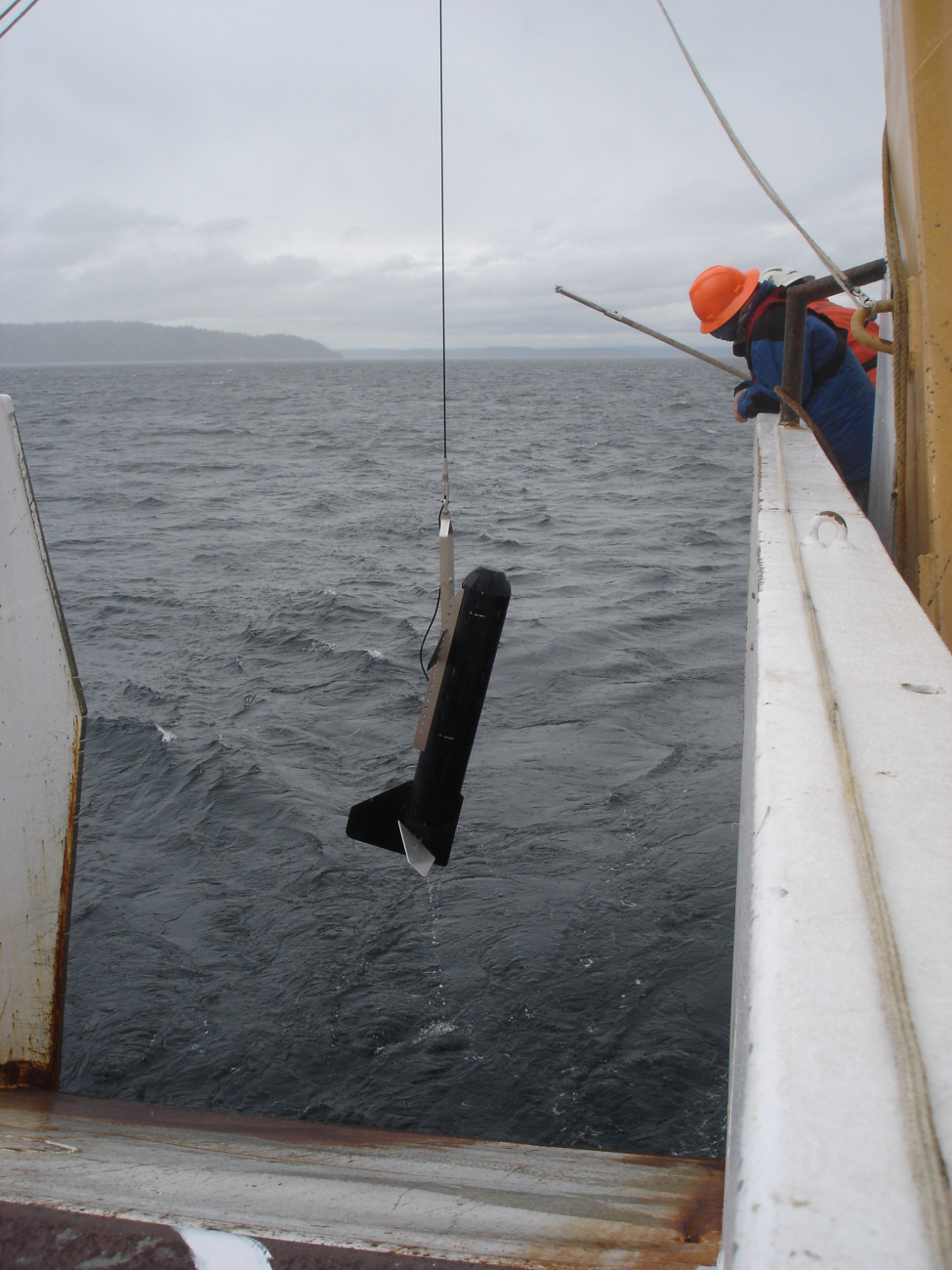 Towed fish being recovered - perhaps a sound velocity sensor or online CTD