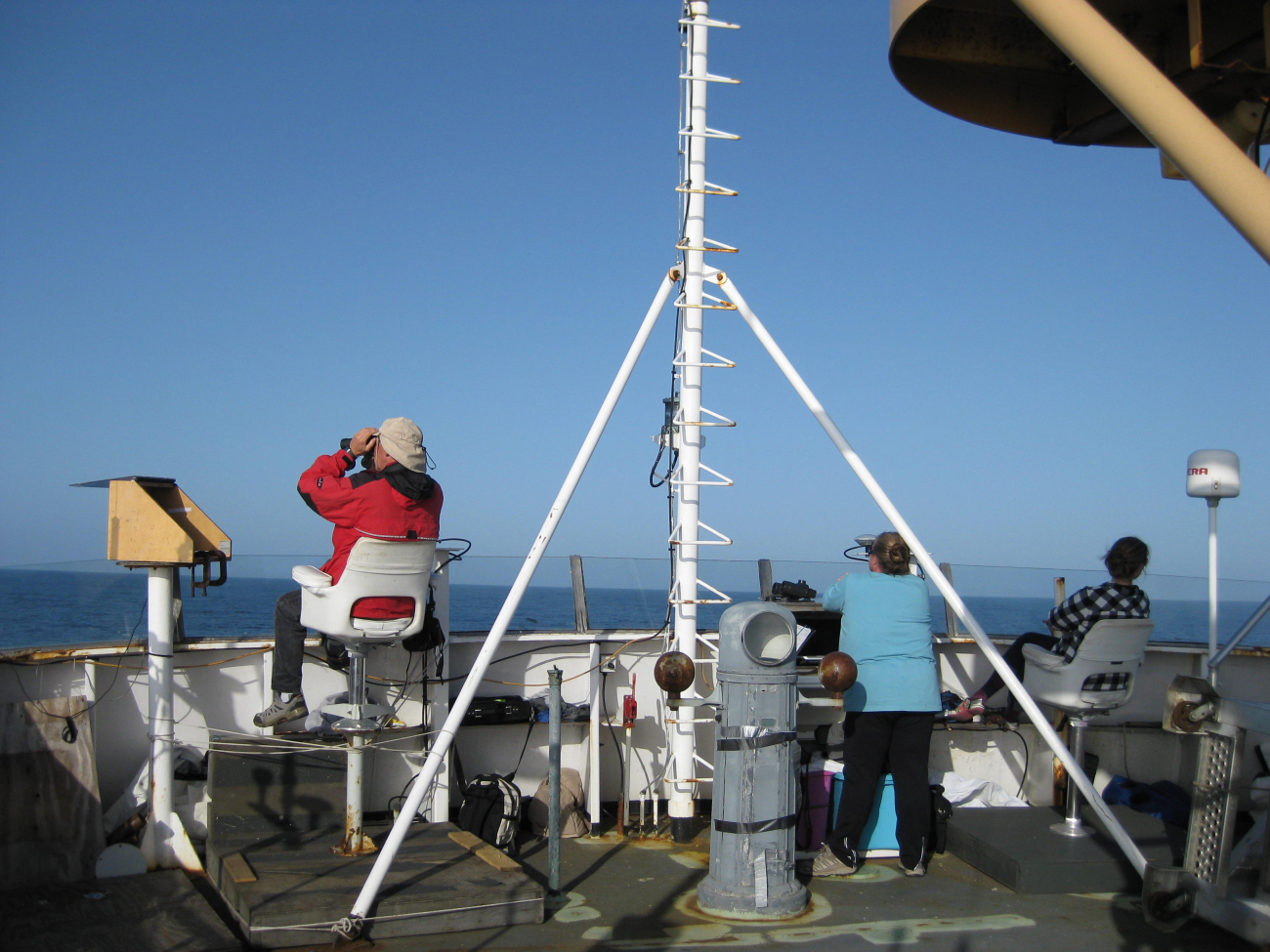 Sea bird and marine mammal observers on the flying bridge of the NOAA ShipMILLER FREEMAN