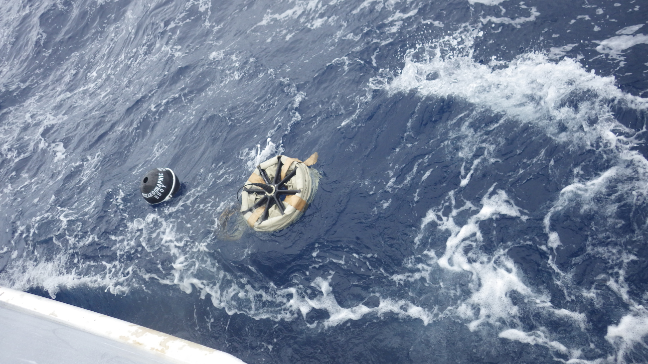A view of the drifter buoy after deployment, showing the float (left) and thedrogue (right)