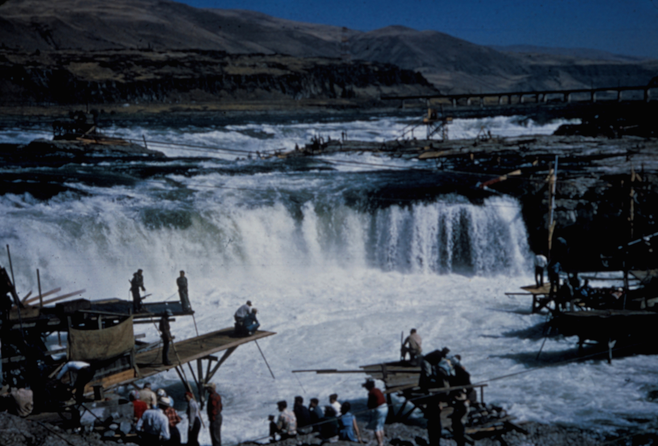 Native Americans dipnet fishing for salmon at Celilo Falls