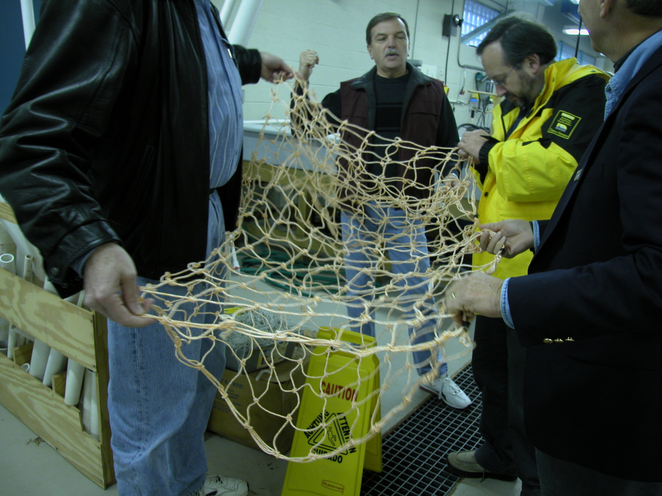 Close-up view of handmade net used in growing marine algae