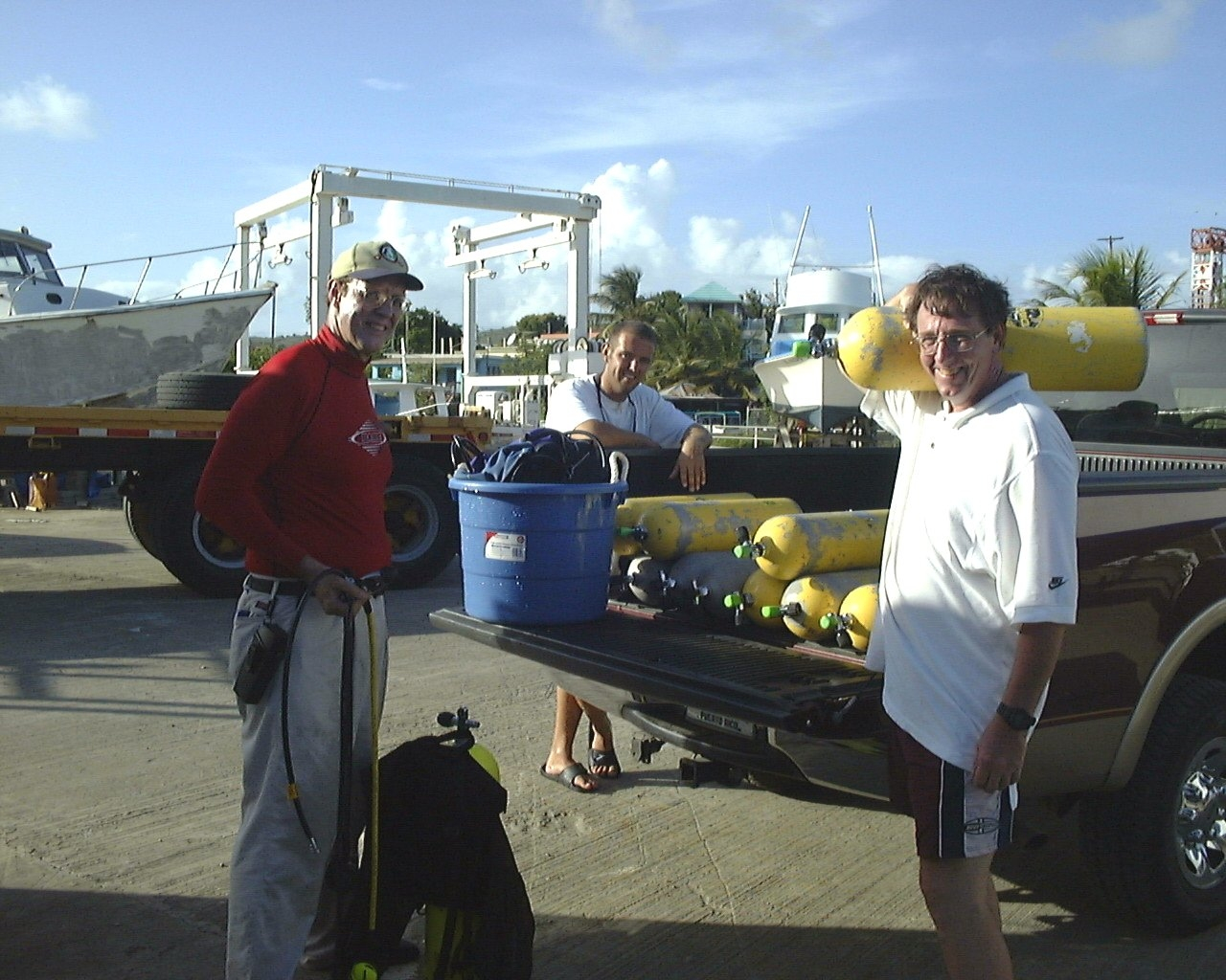 SCUBA tanks being loaded in preparation for work with fish on offshore cage sitein Culebra Island, Puerto Rico