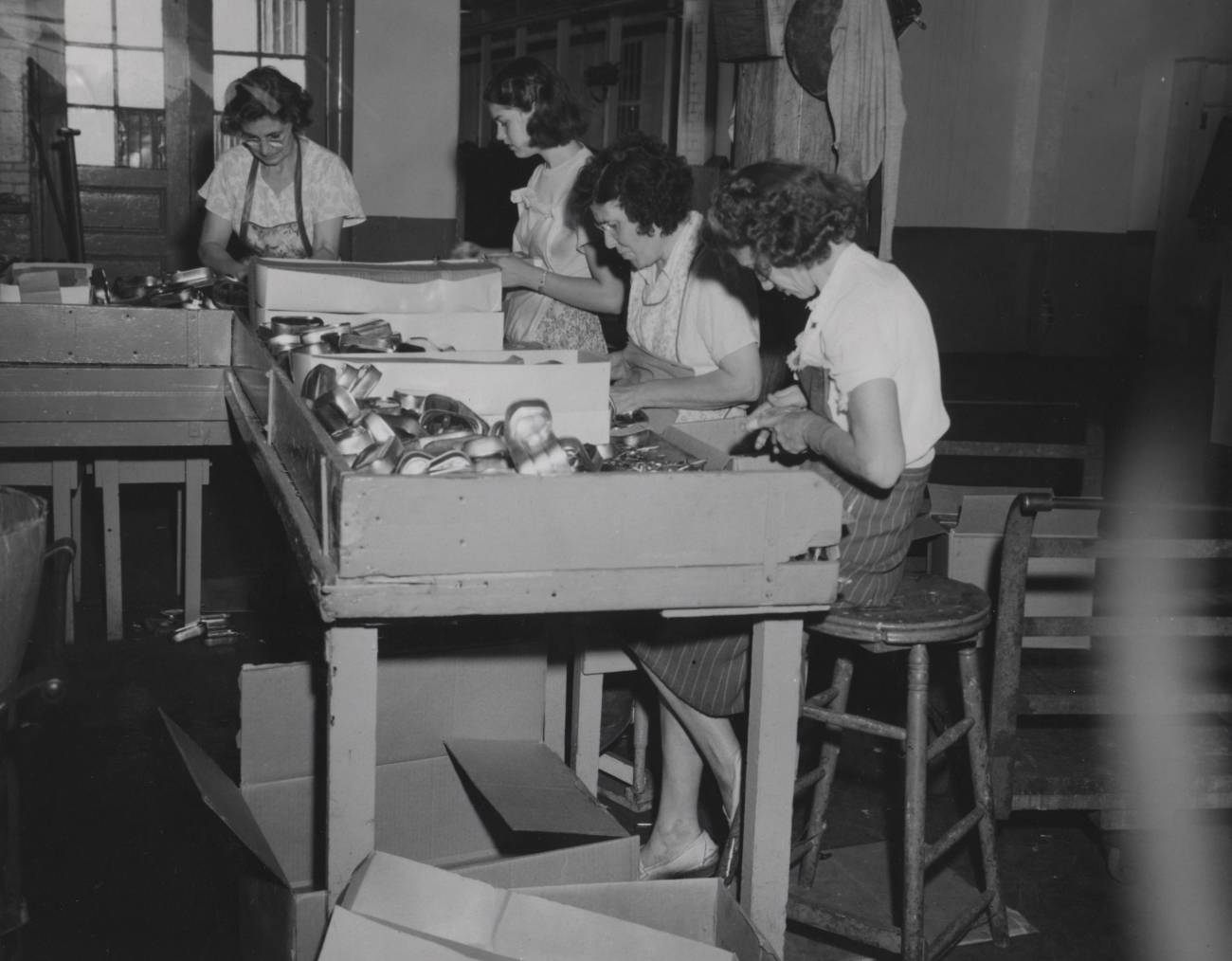 Women on assembly line at sardine cannery