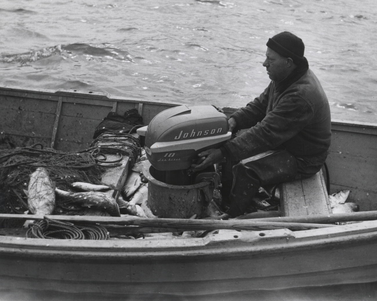 Small boat used in shad fishery - outboard amidships forward to facilitatehauling net over stern