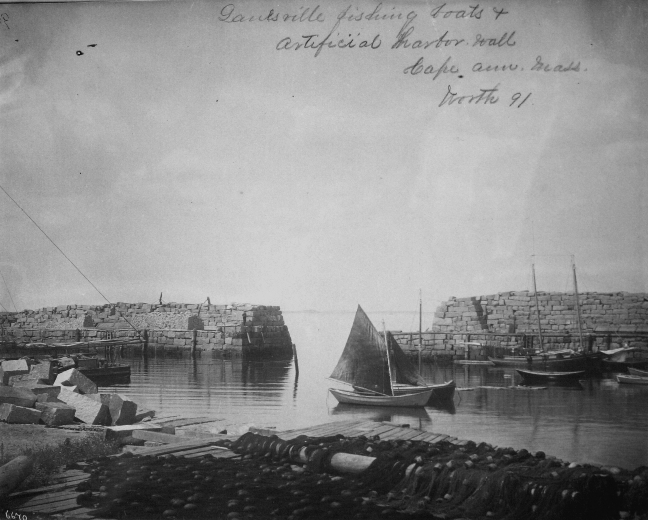 Fishing boats and artificial harbor wall, Cape Ann, MA, Worth, 1891