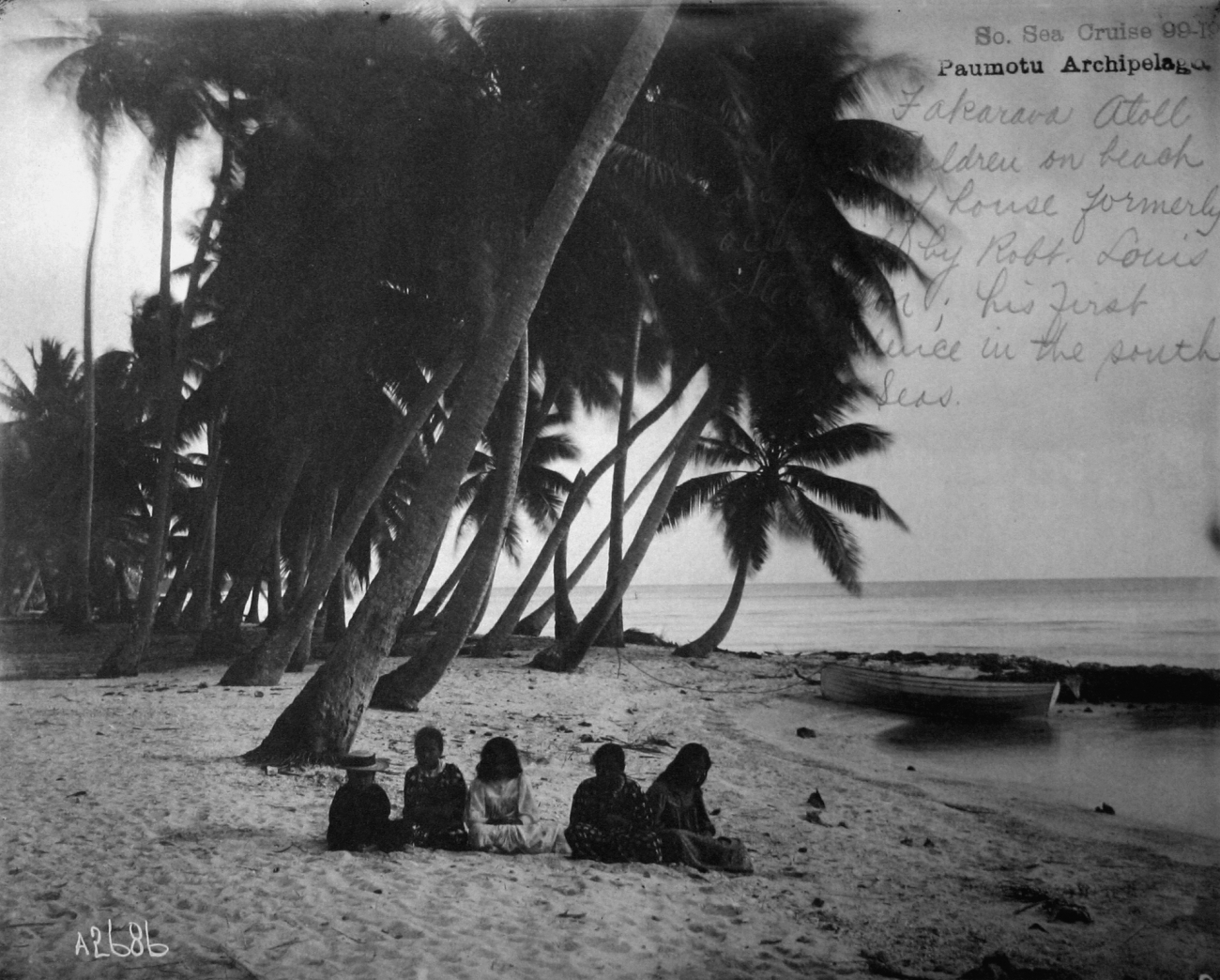 Fakarava Atoll, children on beach with site of house formerly occupied byRobt