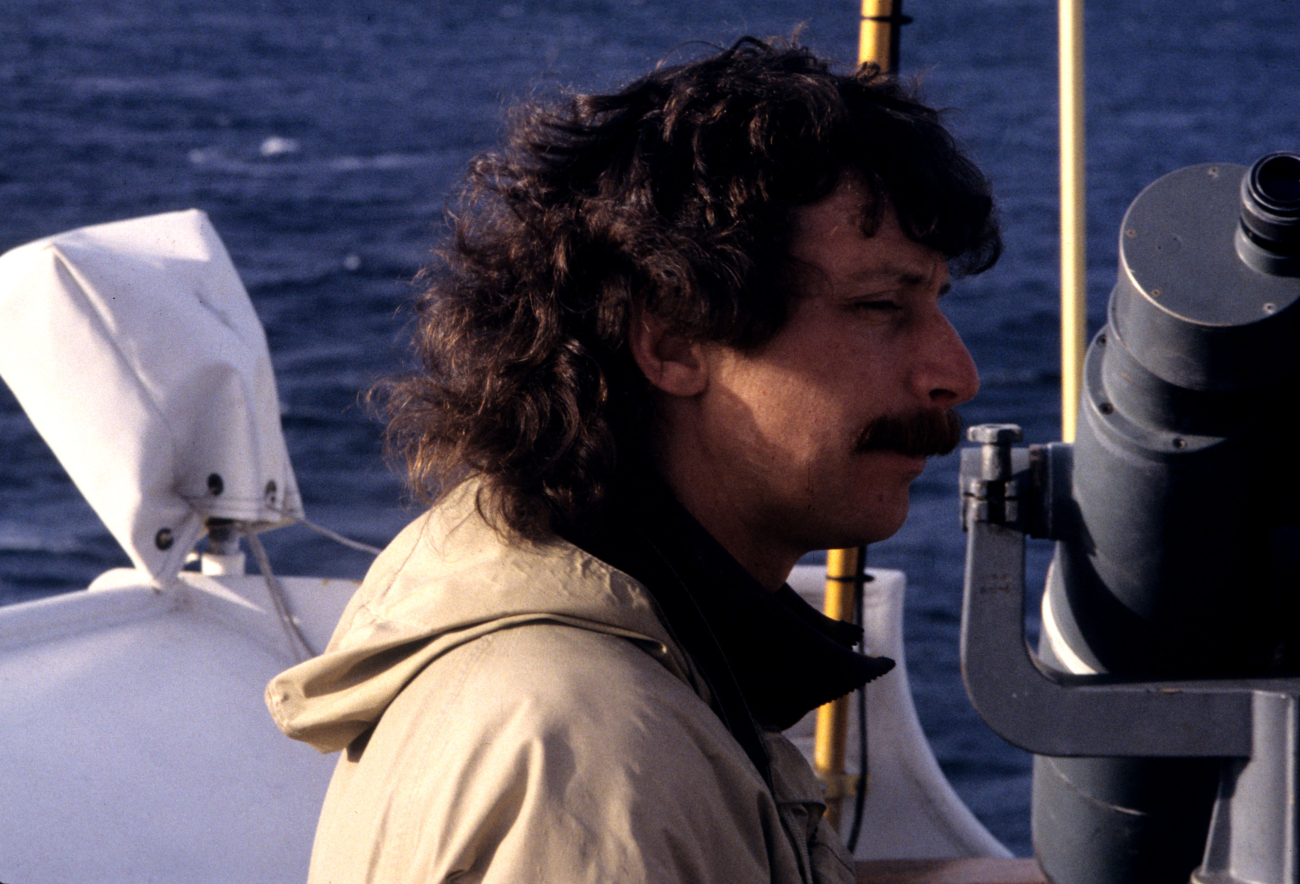 Michael Force, bird observer and zooplankton team member, isalert for marine mammals during the Drake Passage transit
