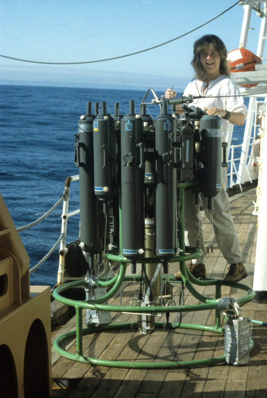 A scientist prepares a CTD rosette, with bottles to collect seawater samples