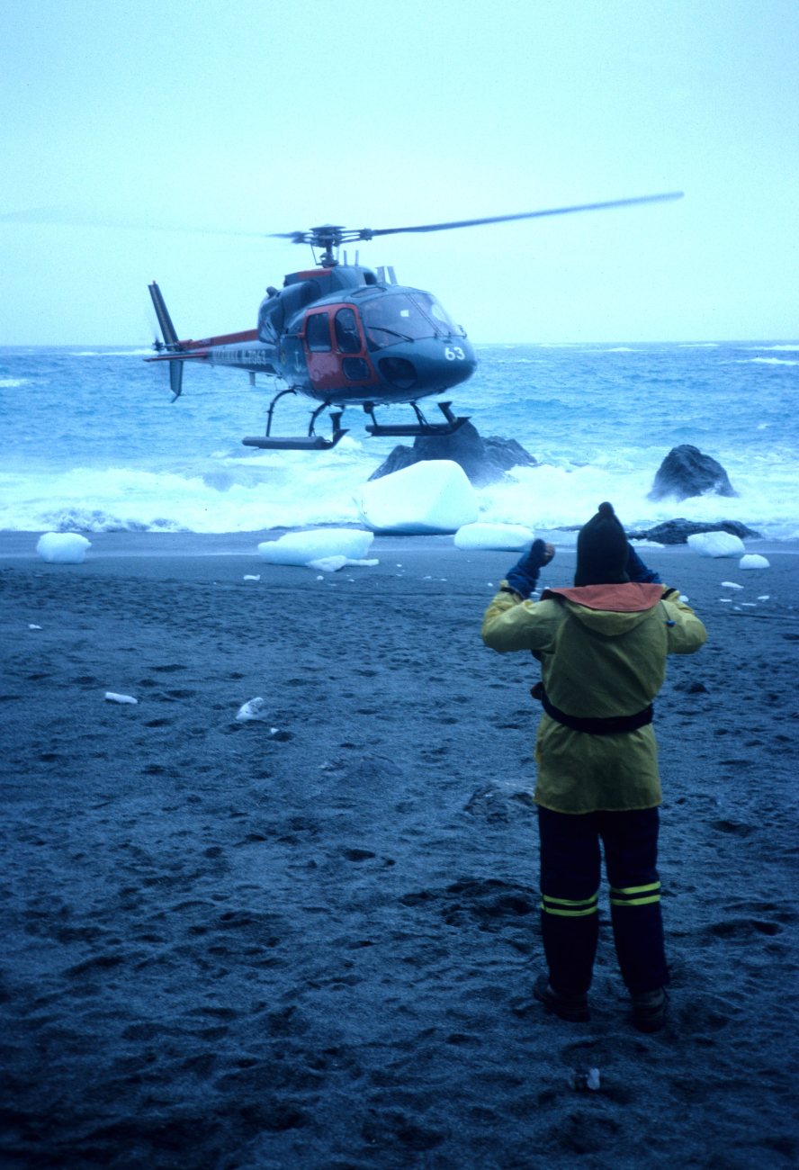 A helicopter makes a beach landing at the Seal Island field station