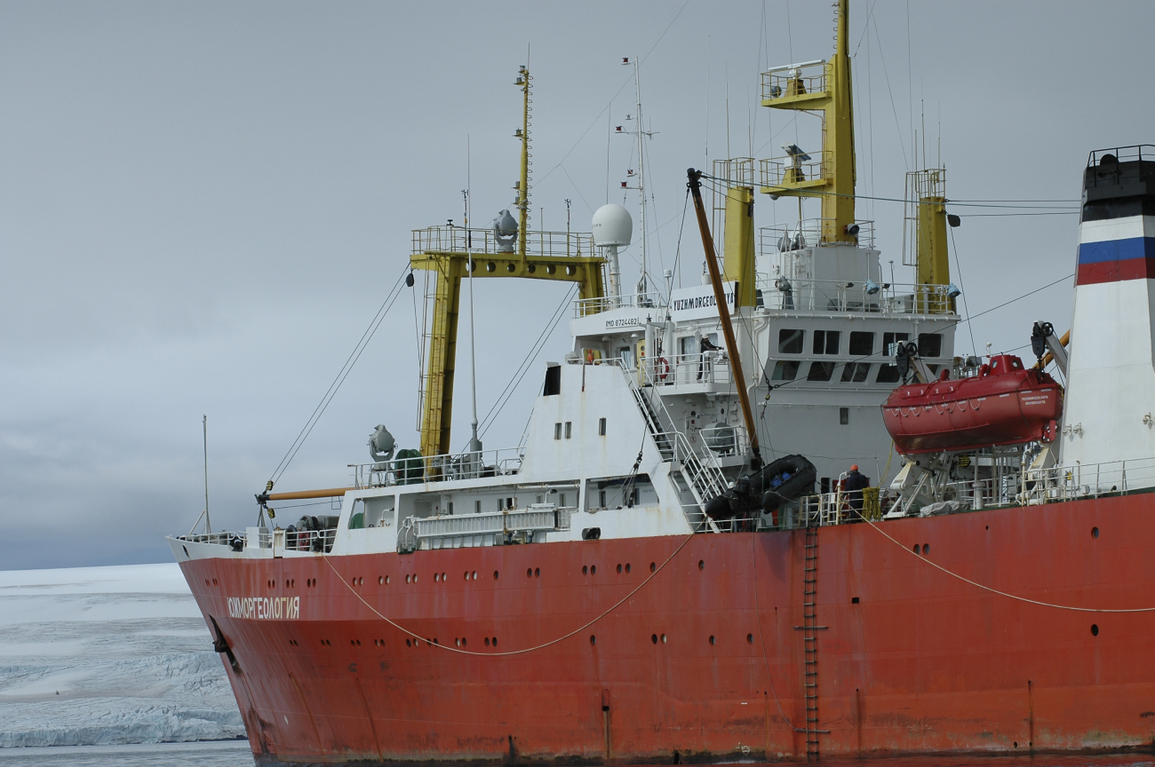 A Zodiac inflatable boat is lowered over the side of the R/V Yuzhmorgeologiyato carry scientists and supplies to the Copacabana field station