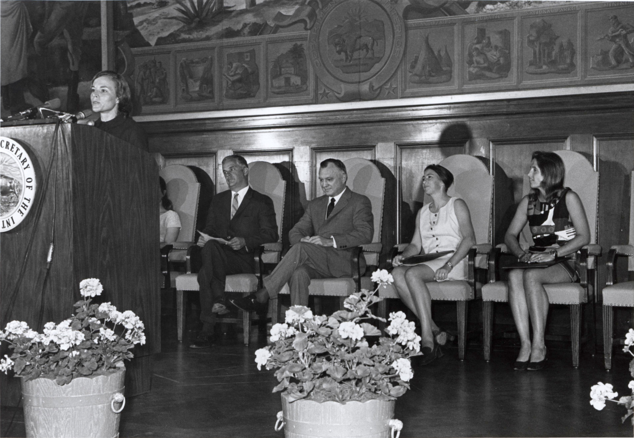 Sylvia Earle at podium during ceremony honoring women aquanauts atDepartment of the Interior